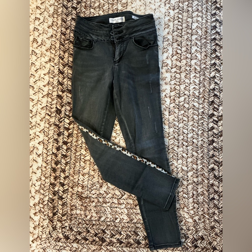 Black women’s skinny jeans with leopard cheetah stripe. Size 7/27